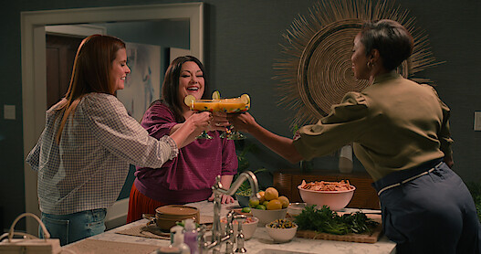 JoAnna Garcia Swisher as Maddie, Brooke Elliott as Dana Sue, and Heather Headley as Helen raise their cocktail glasses together in Season 3 of Sweet Magnolias. 