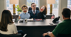 Scott Thompson as Dr. Louis Pfeffer in FUBAR Season 1 holds puppets.
