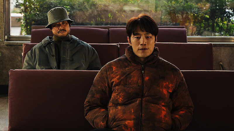 Kim Sung-kyun sits behind Lee Hee-jun in an image from the series 'Karma.'