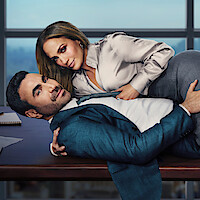 A woman in business attire lies on top of a man in a suit on an office desk with cityscape windows behind them.
