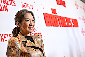 Michelle Yeoh attends Netflix's The Brothers Sun Los Angeles Premiere at Netflix Tudum Theater wearing a gold dress