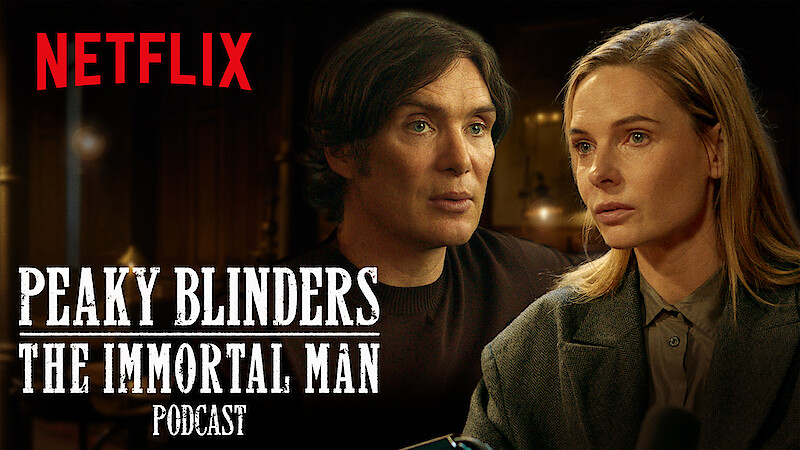 Two serious people sit indoors, warmly lit, in a conversation setting. The Netflix logo and "Peaky Blinders: The Immortal Man Podcast" text is displayed prominently in white across the image.