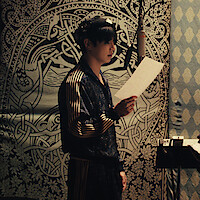 Jung Kook pictured in a recording studio in BTS: THE RETURN