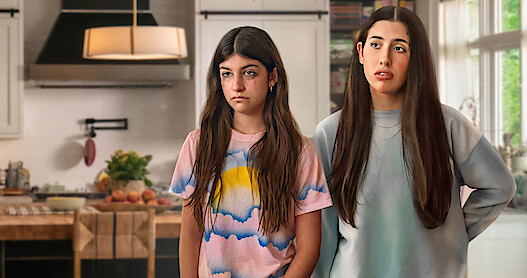 Sunny Sandler as Stacy Friedman and Sadie Sandler as Ronnie Friedman.