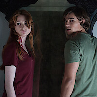 Karen Gillan wearing a red shirt and Brenton Thwaites in a green shirt in Mike Flanagan's Oculus