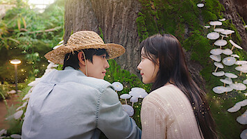 Ahn Hyo-seop as Matthew and and Chae Won-been as Ye-jin observe mushrooms in 'Sold Out on You.'