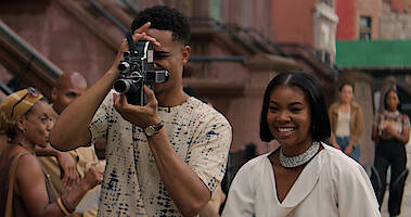 Keith Powers holds a camera next to Gabrielle Union in a still from 'The Perfect Find.'