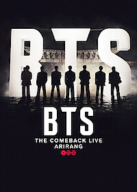 Seven silhouetted figures stand in front of large lit BTS letters on a smoky stage, with text reading "BTS The Comeback Live Arirang" below, suggesting a dramatic concert or event setting.