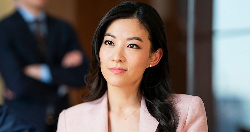 Arden Cho Suits Up — and Heats Up — in the ‘Partner Track’ Trailer