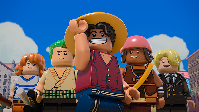 Five LEGO minifigures with varied outfits stand outdoors under a blue sky with clouds, appearing confident and adventurous in a cityscape setting.