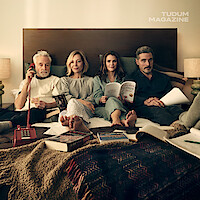 Keri Russell, Rufus Sewell, Allison Janney, and Bradley Whitford lounge in their pajamas together in bed.