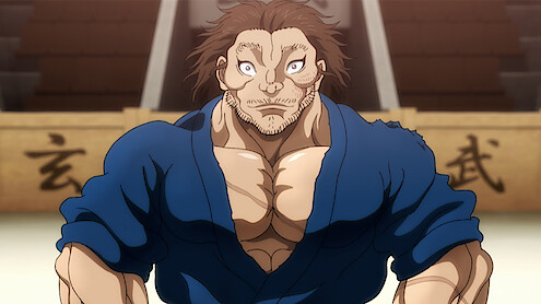 A heavily muscled and calm samurai Musashi Miyamoto standing in a fighting arena.