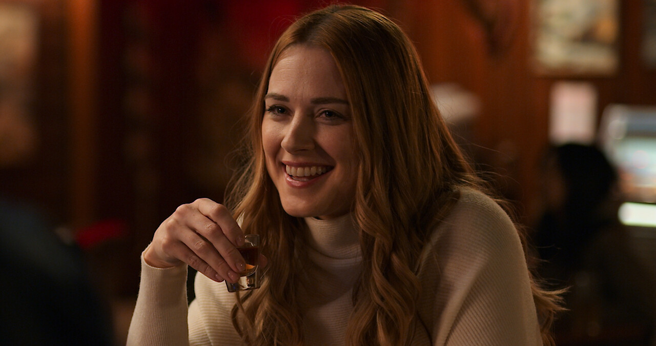 Woman smiling abou to take a shot