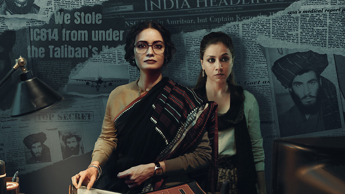 IC814 Highjack key art, two woman standing in front of a newspaper background