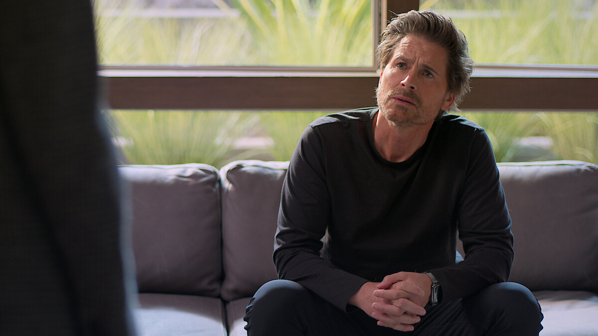 Rob Lowe sits on a couch in Season 2 of 'Unstable'