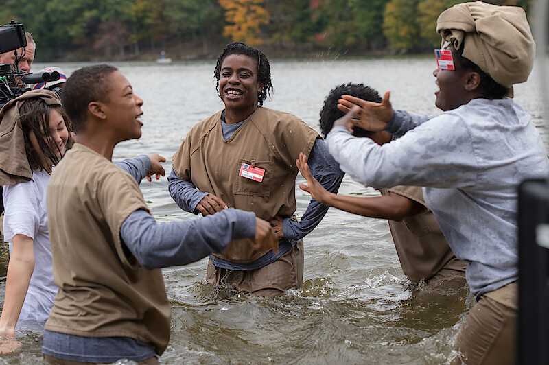 (L to R) Kimiko Glenn as Brook, Samira Wiley as Poussey, Uzo Aduba as Suzanne "Crazy Eyes", Danielle Brooks as Tasha "Taystee" on the set of Orange Is The New Black Season 3.
