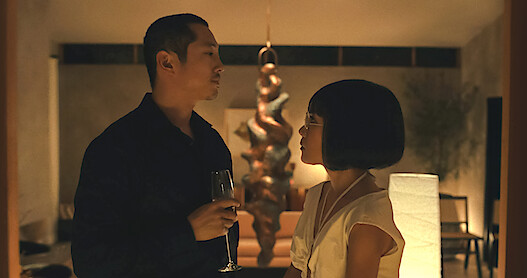 Stephen Yeoung and Ali Wong looking at each other in a room