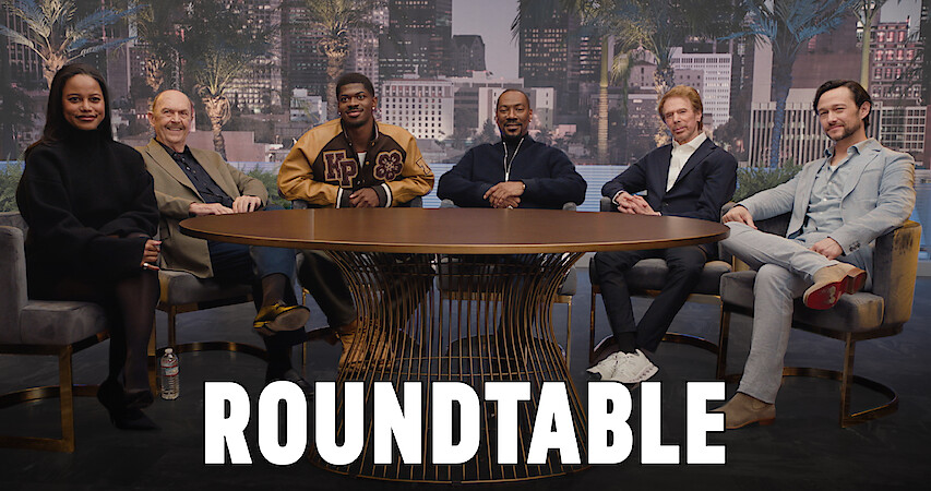 Taylour Paige, John Ashton, Lil Nas X, Eddie Murphy, Joseph "Beverly Hills: Axel F", Jerry Bruckheimer, and Lil Nas X sit around a table. 