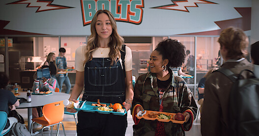 Jodi and Fareeda in the cafeteria getting ready to eat lunch