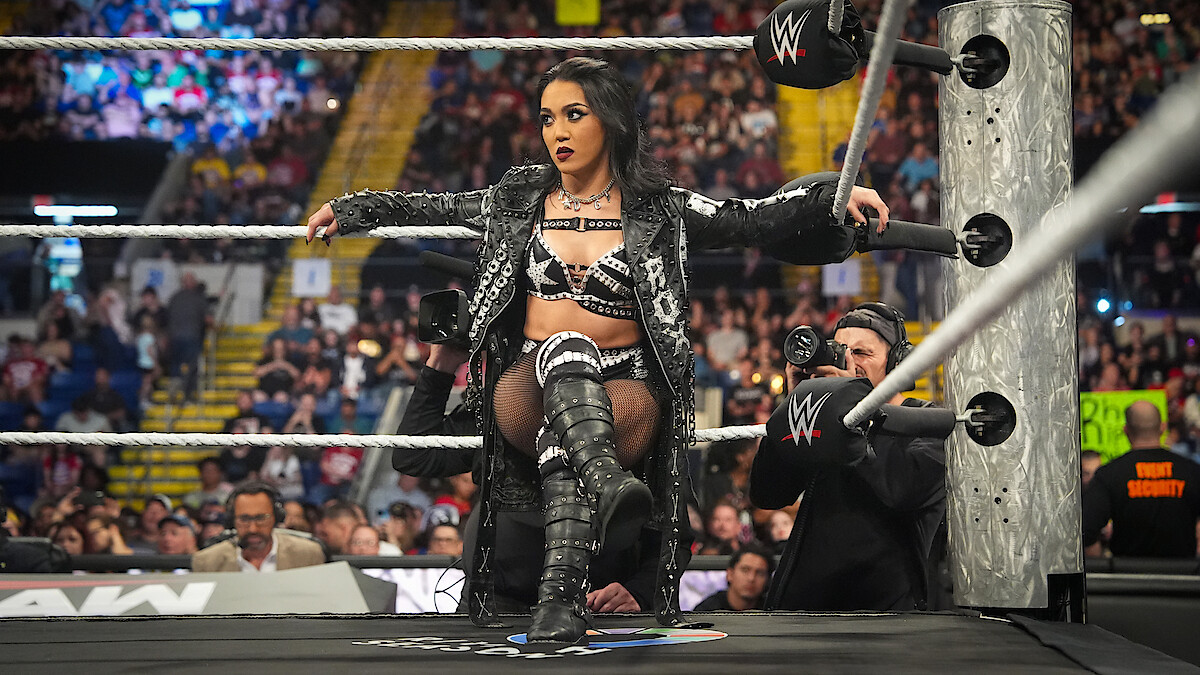 Roxanne Perez sitting on a rope during Monday Night RAW