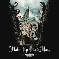 The Cast of Wake Up Dead Man looks into a grave