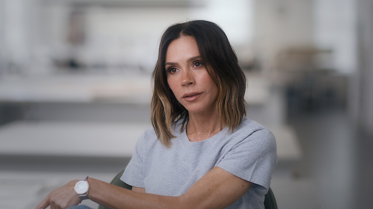 Victoria Beckham looks into the distance in deep contemplation.