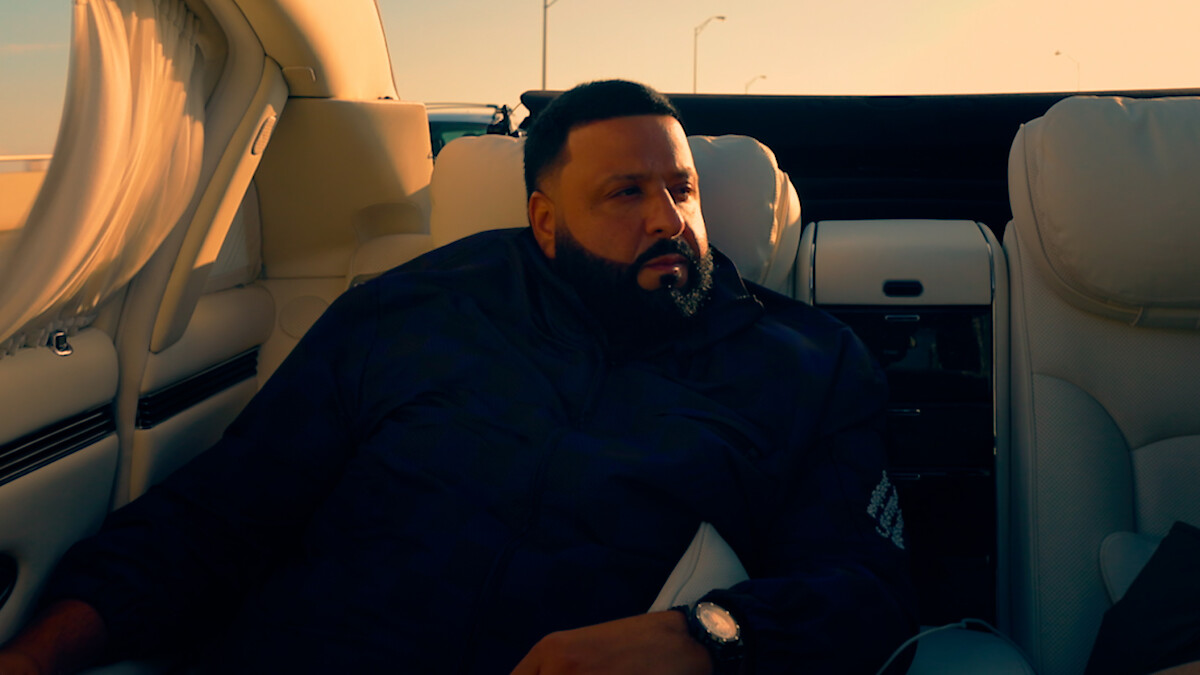DJ Khaled in the back of a car.
