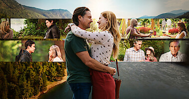 Alexandra Breckenridge as Mel Monroe and Martin Henderson as Jack Sheridan embrace in front of the scenic landscape of Virgin River in Season 4 of 'Virgin River.'