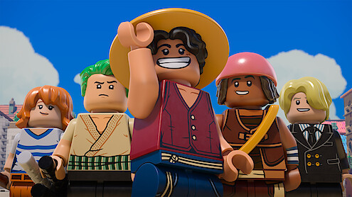 Five LEGO minifigures in pirate-themed outfits stand outdoors under a blue sky, looking determined and cheerful, with buildings and clouds in the background.