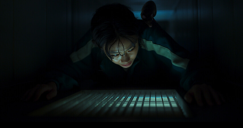 A woman plays a game on 'Squid Game'