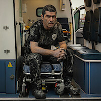 Man in sullied police uniform.