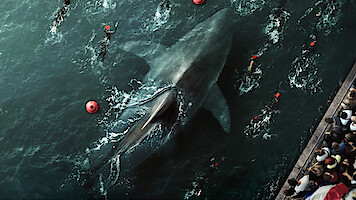 People swim around a giant shark in the Seine in 'Under Paris.'