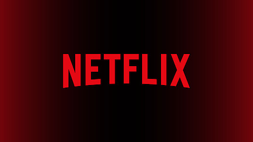 Large red letter "N" in the center of a black background with a red gradient, representing the Netflix logo.