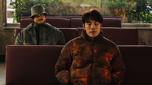 Kim Sung-kyun sits behind Lee Hee-jun in an image from the series 'Karma.'