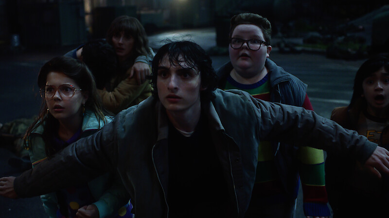 Winona Ryder as Joyce Byers, Finn Wolfhard as Mike Wheeler and Jake Connelly as Derek in 'Stranger Things 5'