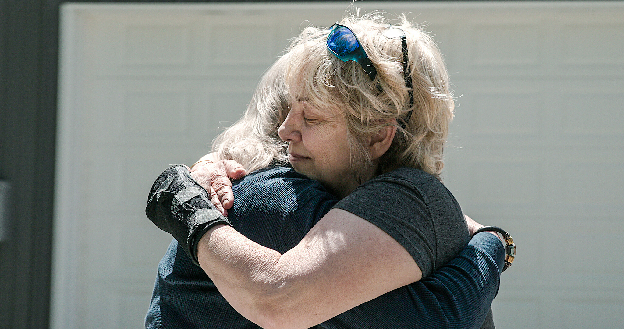 A mother and her daughter embracing