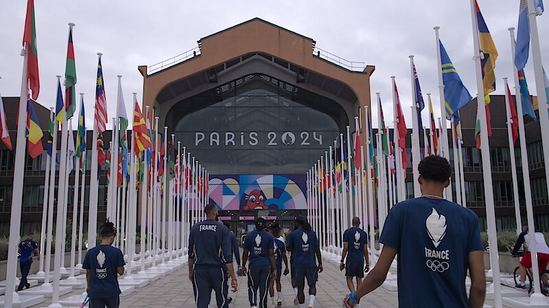 France Basketball Men's Olympic Team entering an arena.
