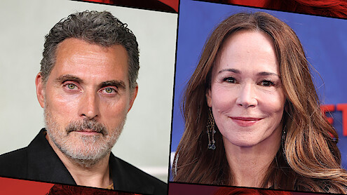 Split image of a man with short, graying hair and beard in a black shirt against a light background, and a woman with long brown hair, earrings, and a smile in front of a blue background, both in close-up portraits.