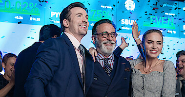 Chris Evans, Andy García, and Emily Blunt celebrate in a still from 'Pain Hustlers.'