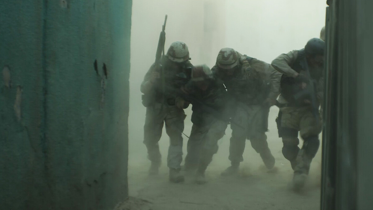 Army Rangers helping each other during a firefight