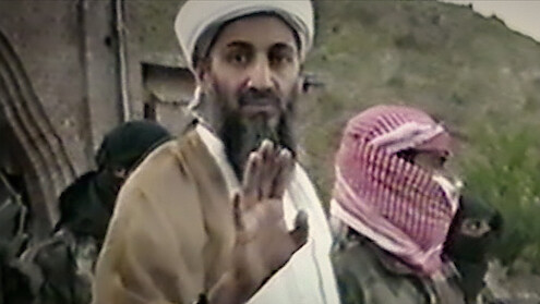 Osama bin Laden waving hand