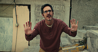 Mauricio Ochmann raises his hands in a surrendering pose in 'Non Negotiable'