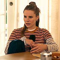Kristen Bell as Joanne holds a microphone in 'Nobody Wants This' Season 2.