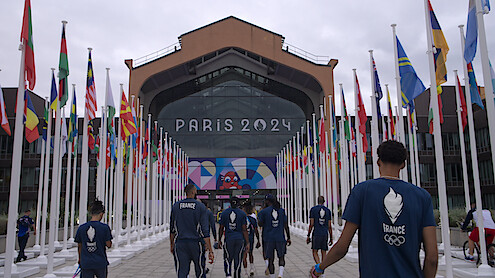 France Basketball Men's Olympic Team entering an arena.