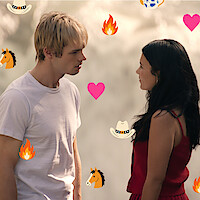 A young man and woman stand facing each other outdoors, surrounded by cartoon icons of cowboy hats, hearts, horses, fire, and flowers, suggesting a romantic or dramatic moment with a playful, western-themed overlay.