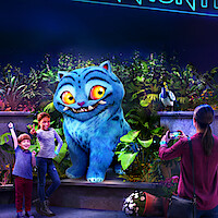 A large, animated blue cat with yellow eyes poses with two happy children in front of lush, glowing plants, while an adult takes their photo in a colorful, vibrant nighttime setting.