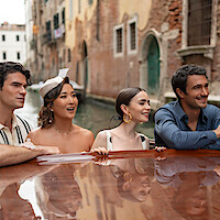 Paul Forman as Nicolas De Leon, Ashley Park as Mindy, Lily Collins as Emily and Eugenio Franceschini as Marcello in 'Emily in Paris' Season 5.