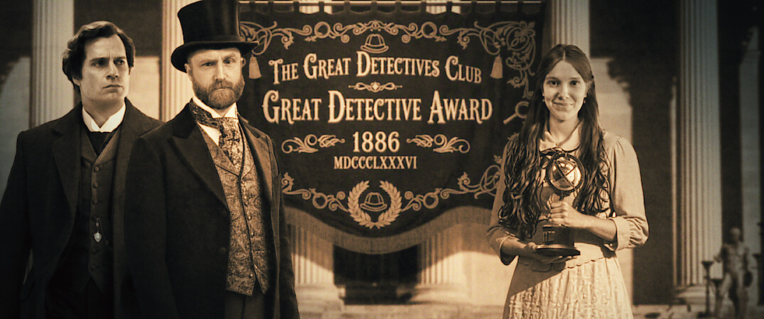 Three people in Victorian-era attire stand before a banner reading "The Great Detectives Club Great Detective Award 1886"; one woman holds a trophy, the scene set within grand architectural columns, evoking a formal ceremony.