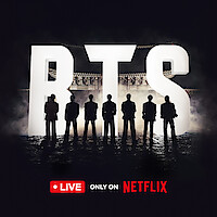 BTS standing silhouetted against giant 'BTS' letters