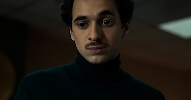 Crypto boy - Man with a mustache wearing a turtleneck